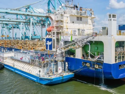 Clean-Jacksonville Tugboats and a large cargo ship docked at the port in Jacksonville.
